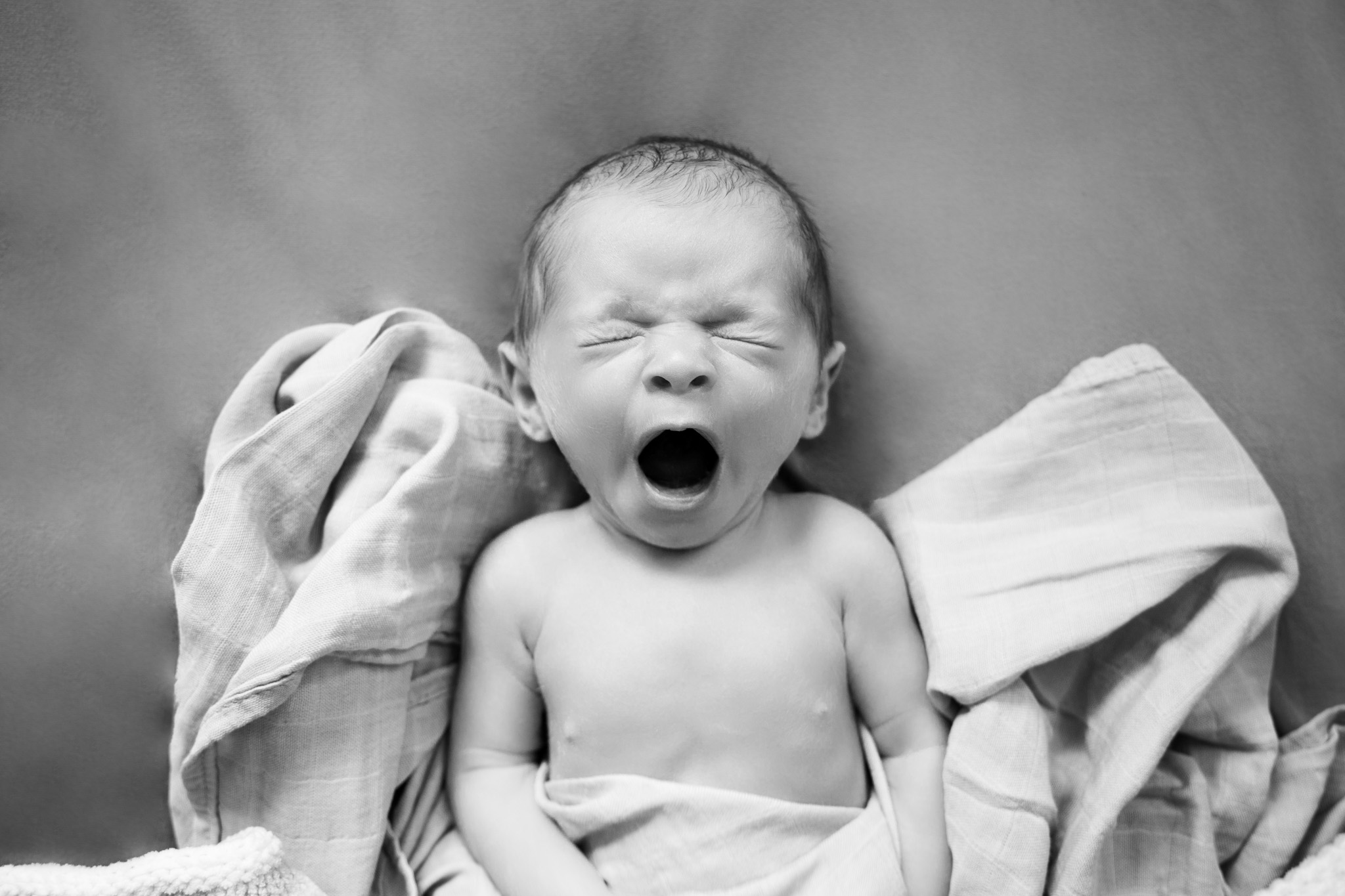 Hampshire newborn photographer NK Photography baby photos hampshire (5) black and white baby yawning - newborn photographer Hampshire baby photos NK Photography