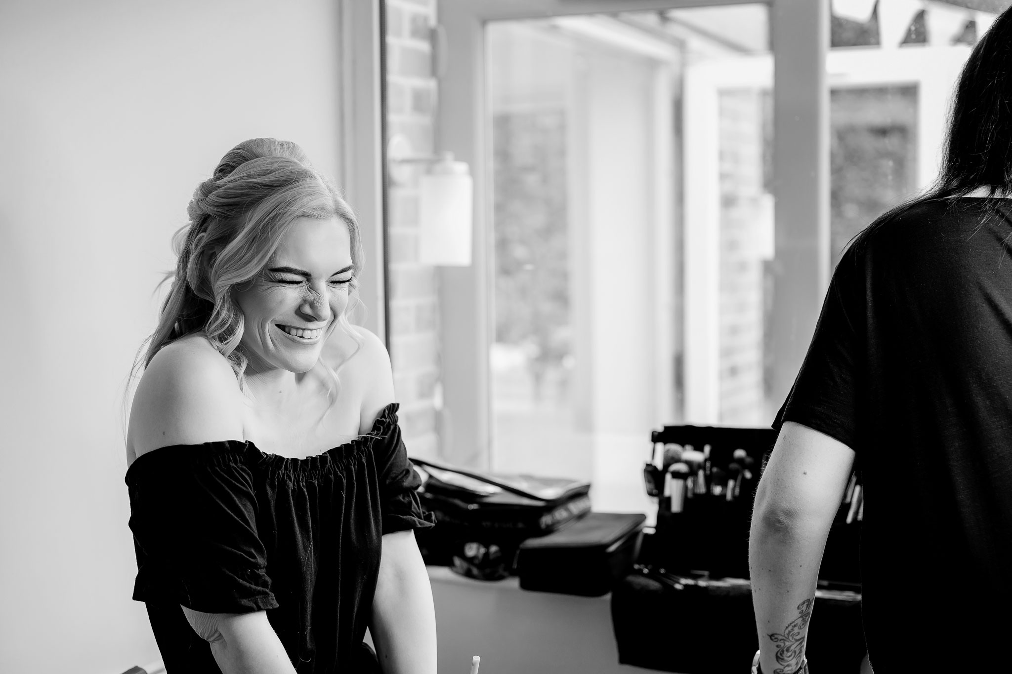 NK_Photography_hampshire_wedding_photographer the bride happy with her make up