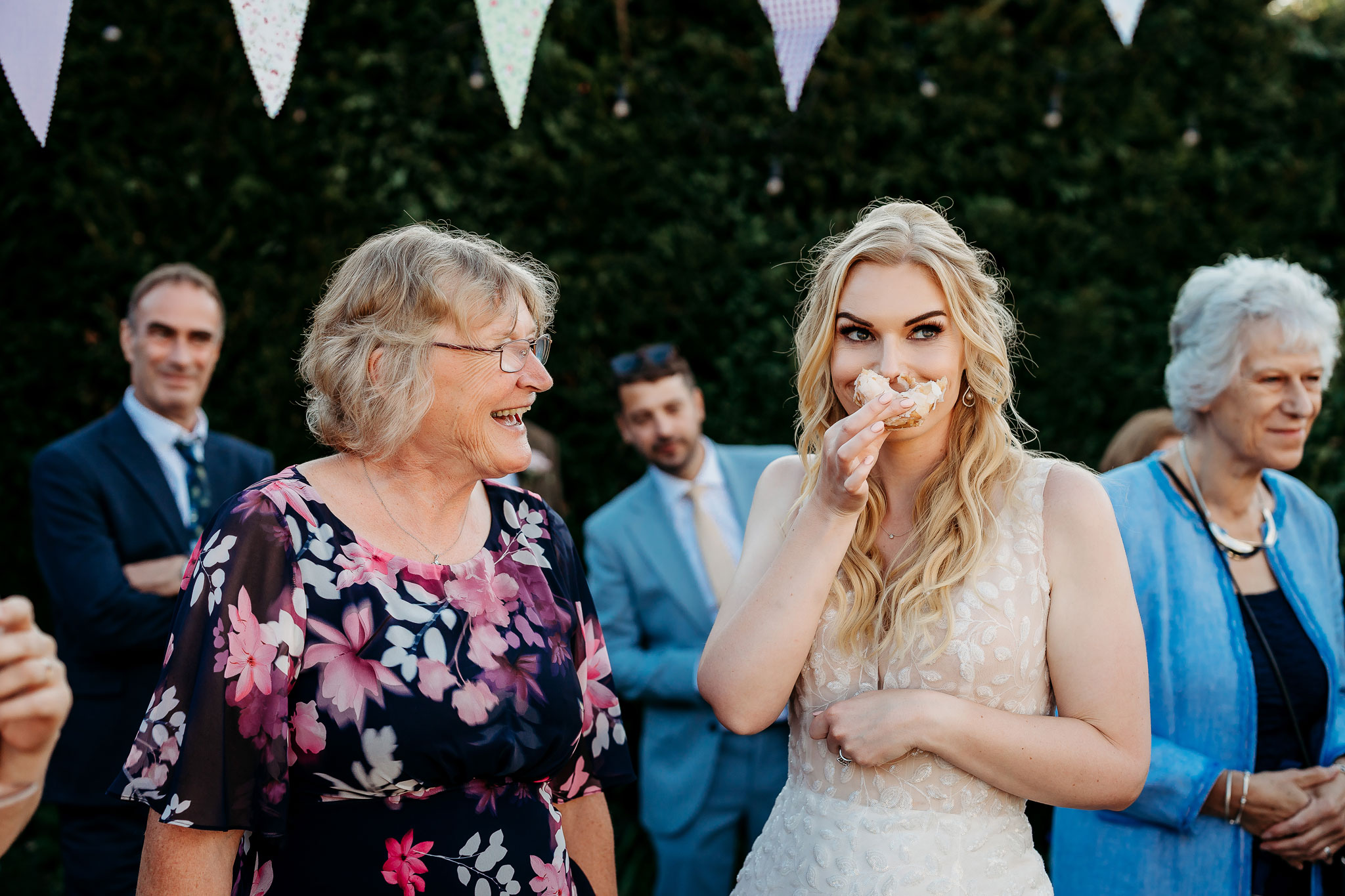 the bride smiling with her doughnut