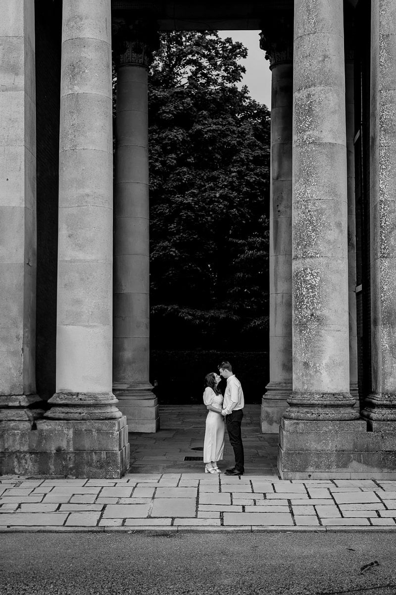 an engaged couple in Winchester peninsula square monochrome image