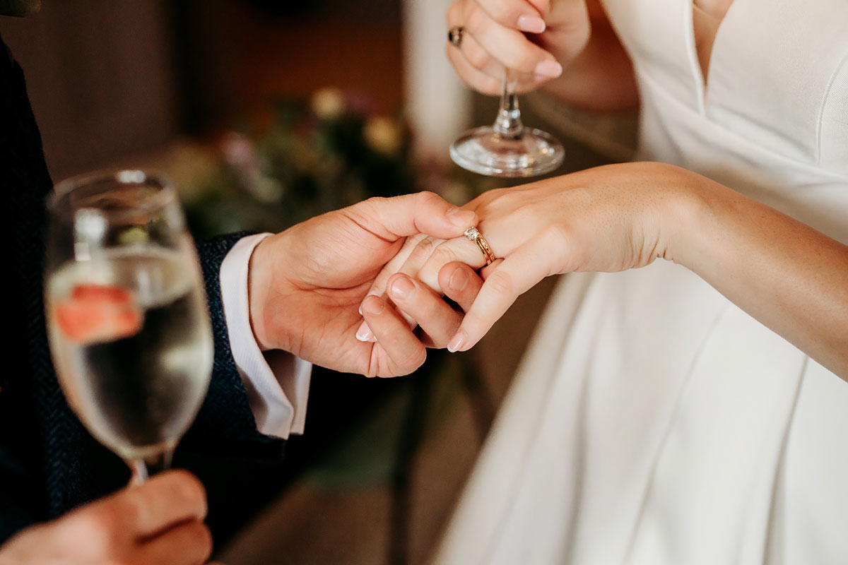 groom holding brides hand