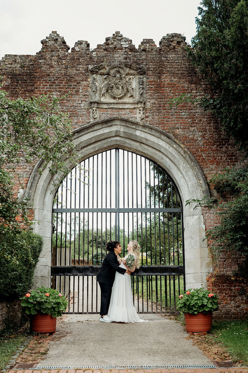 the happy couple at the old basing house gates