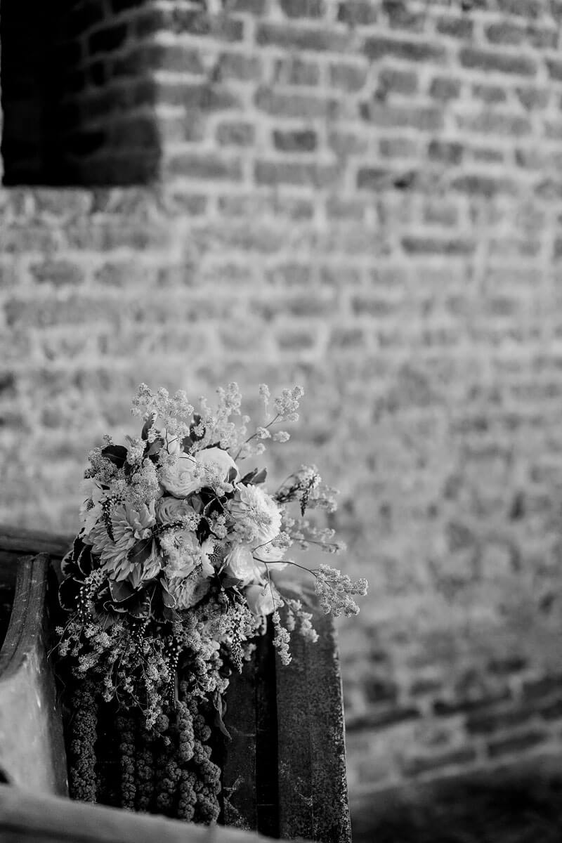 a black and white image of a wedding bouquet on the barrel