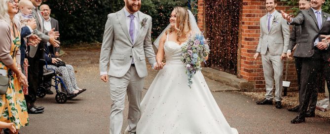 a bride and groom enjoying their confetti photos