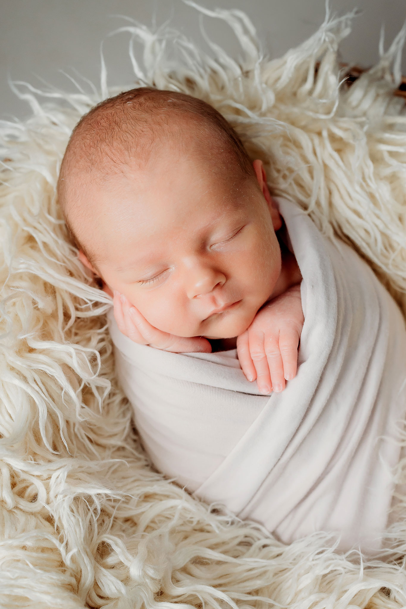 newborn swaddled in a blanket