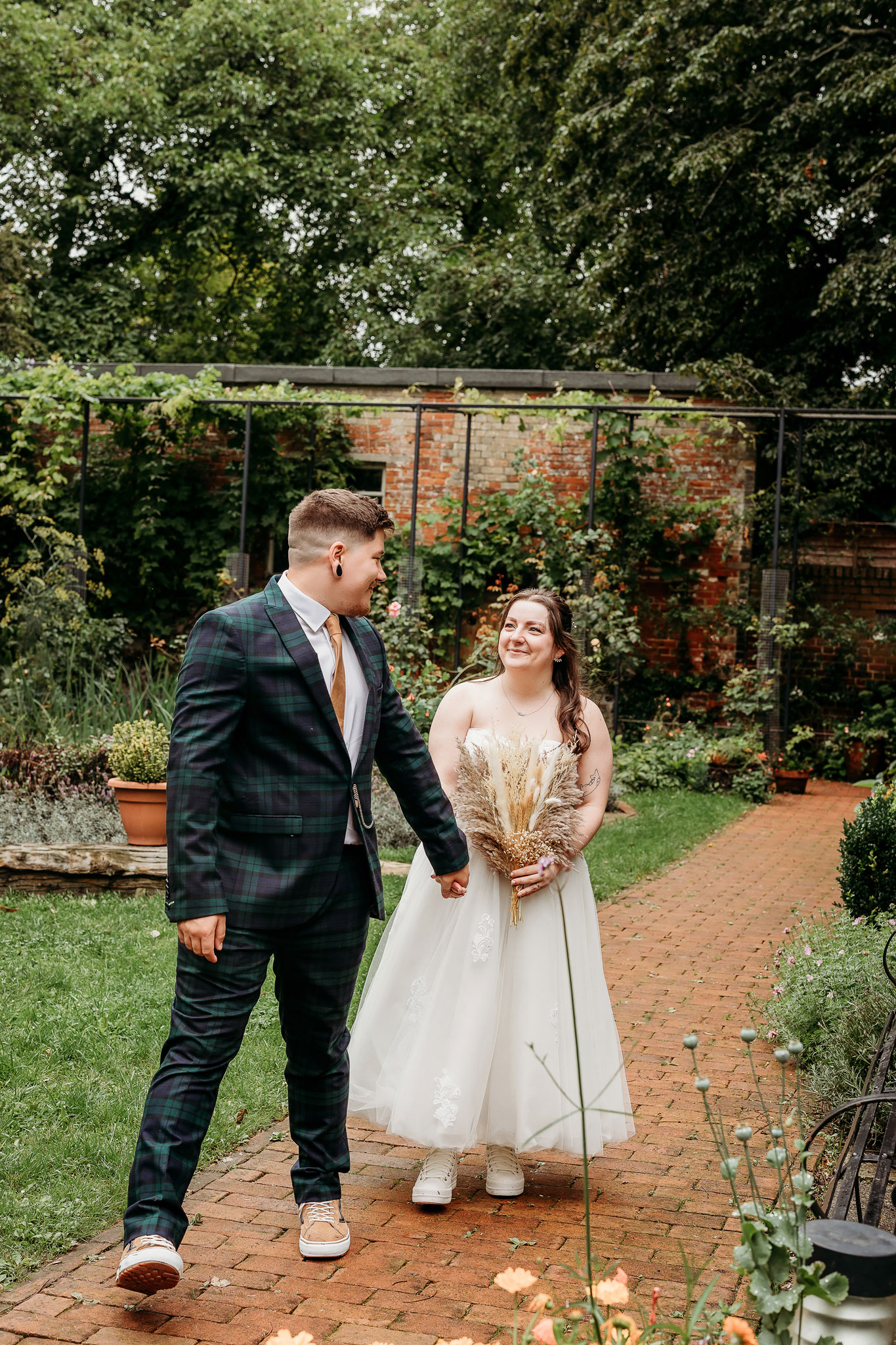 a bride and groom at the secret garden