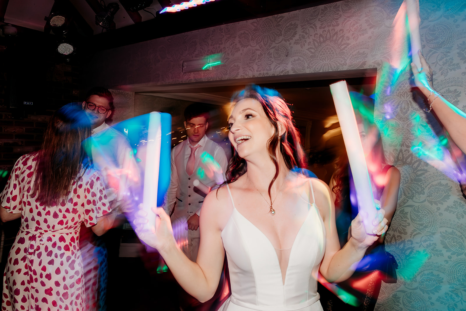 bride glow stick wedding party photos