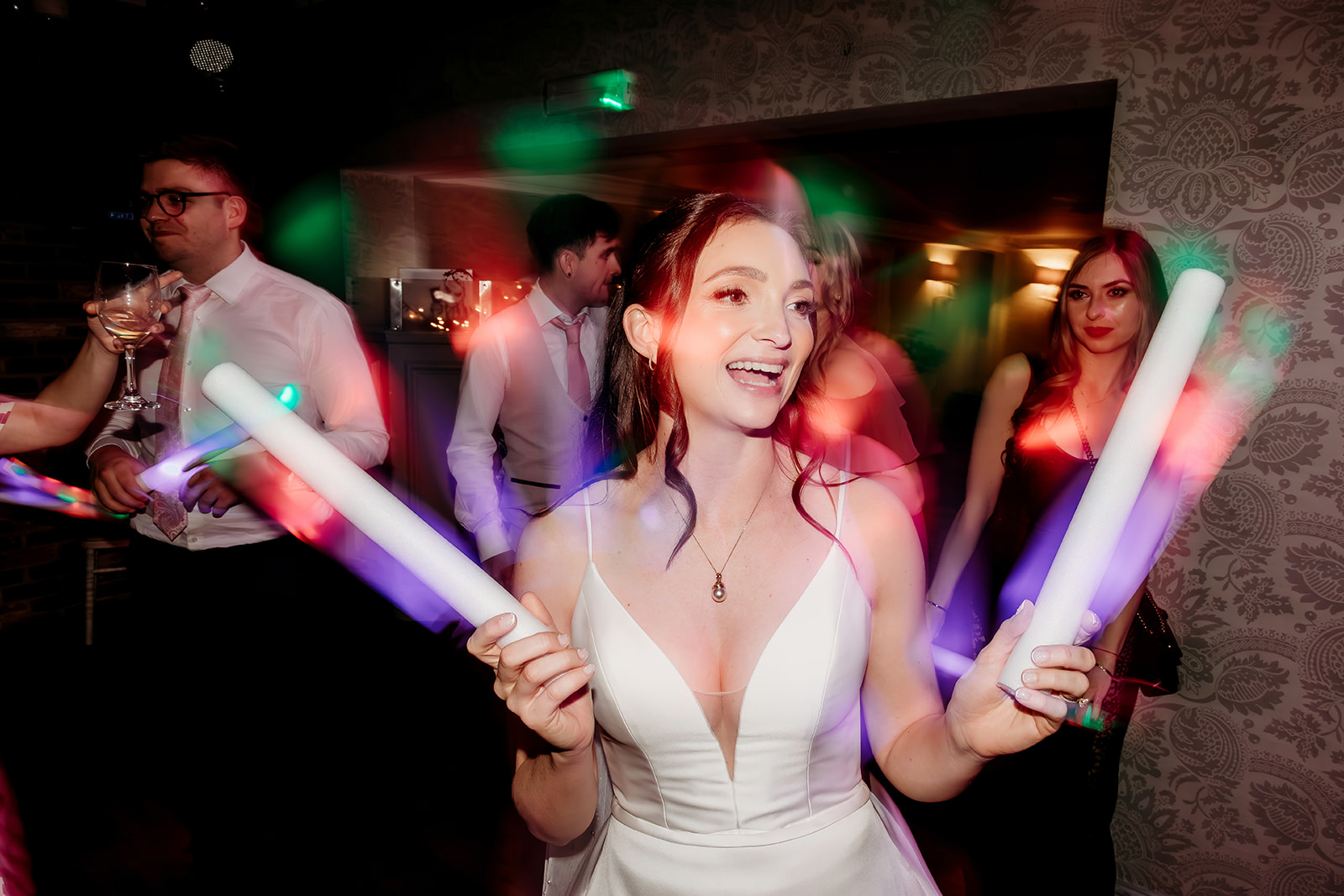 bride glow stick wedding party photos