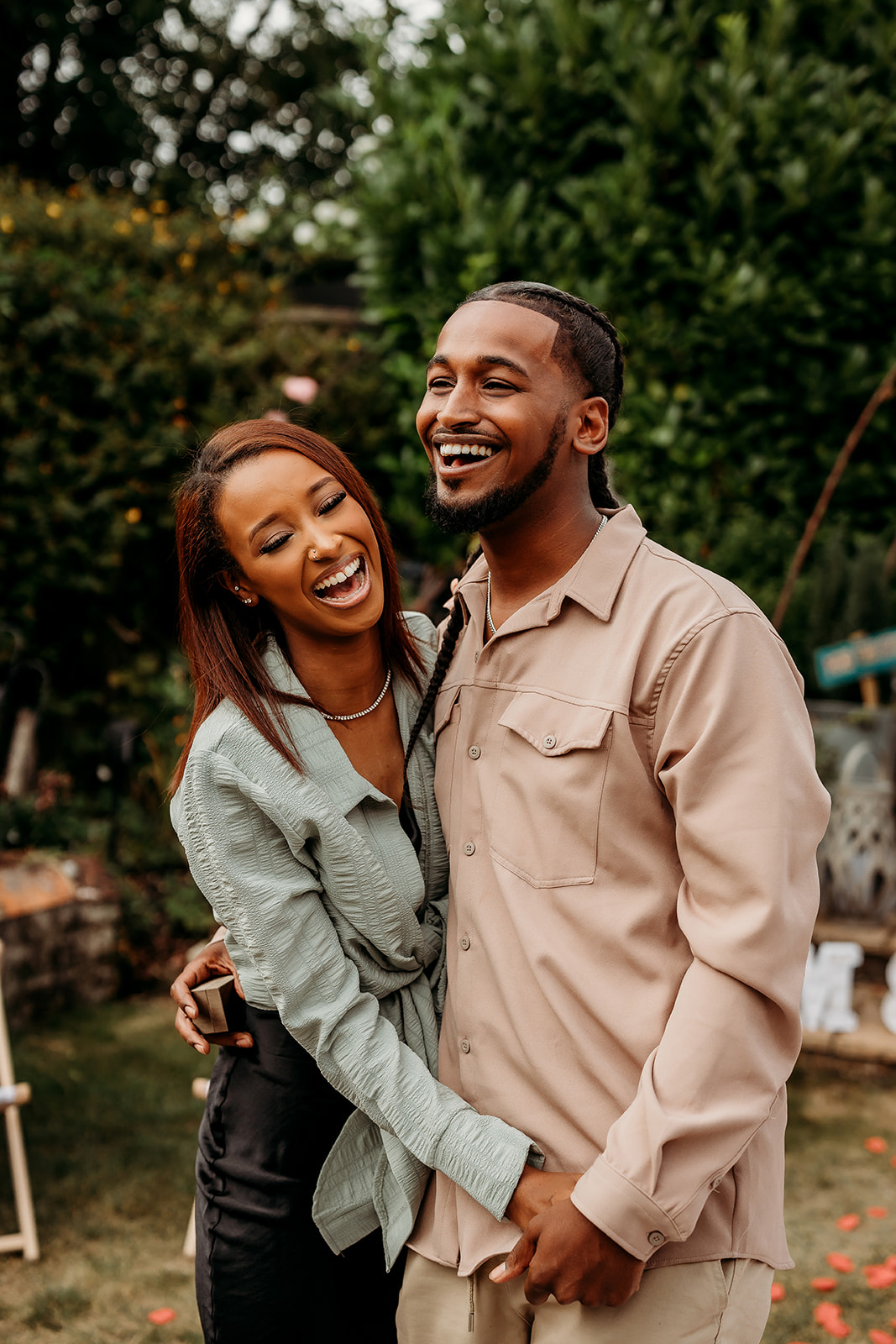 couple laughing after getting engaged captured by a hampshire engagement photographer a couple laughing naturally during their engagement session