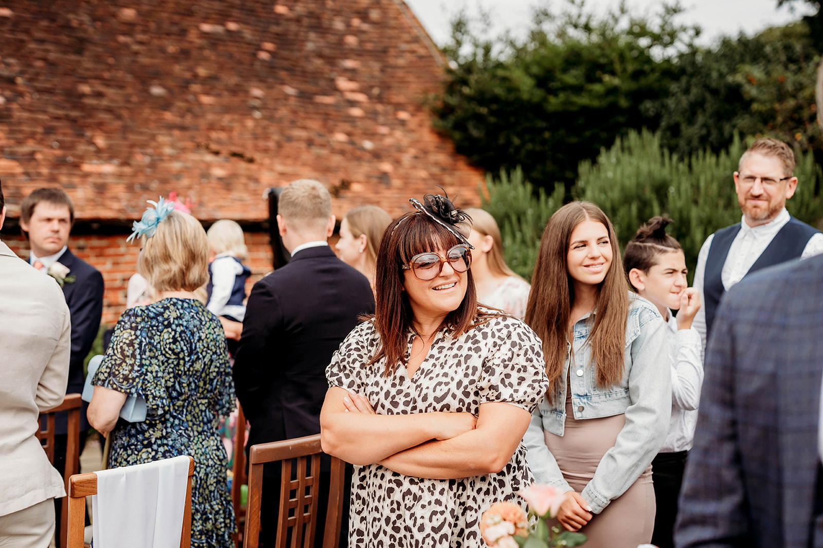a guest smiling at a wedding, captured by a Hampshire wedding photographer