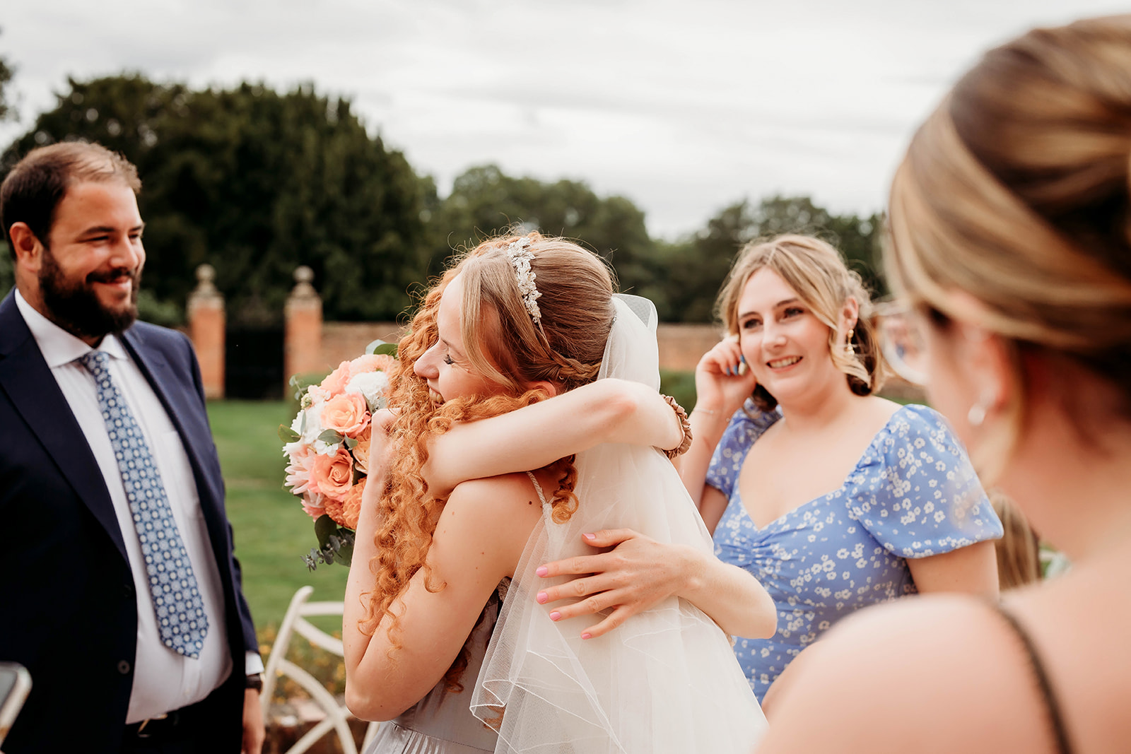 a bride interacting with her guest, captured by a Hampshire wedding photographer