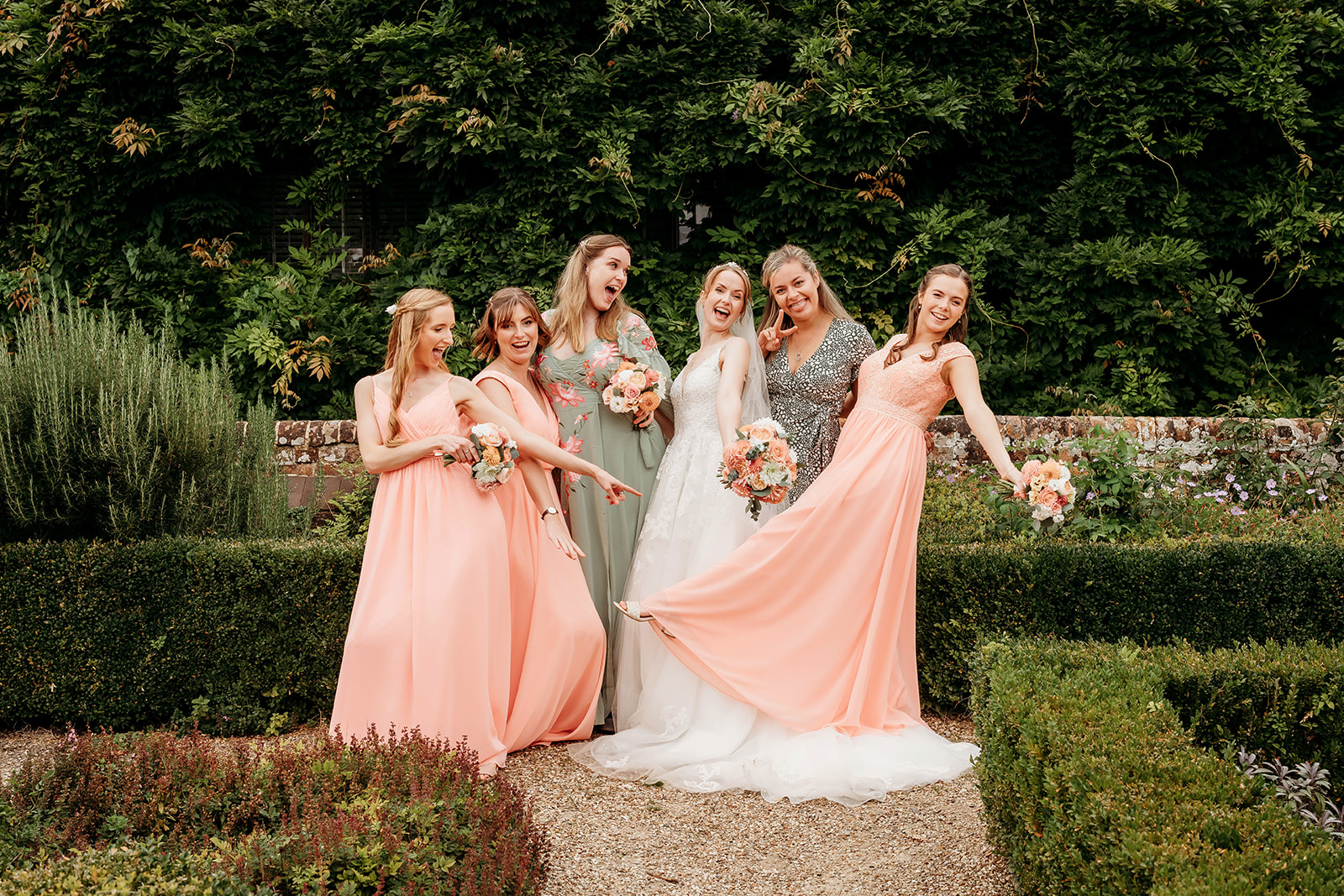 a bride and her bridesmaids and friends having fun, captured by a Hampshire wedding photographer
