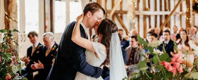 the kiss after I do at the clock barn Wiltshire wedding venue