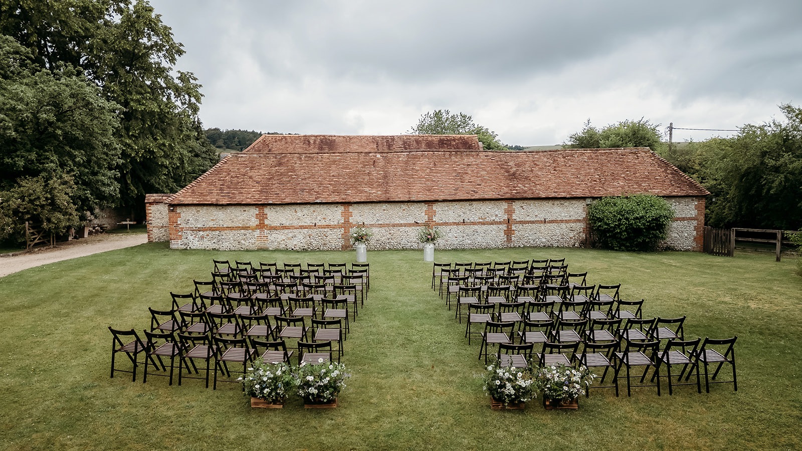 drone photo of a garden wedding ceremony drone photo of a garden wedding ceremony