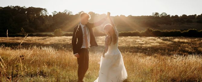 bride and groom dancing at golden hour captured by a hampshire wedding photographer