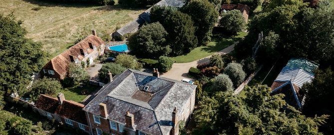 a view from the drone of Combe manor barns