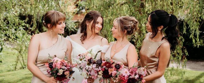 a bride and her bridesmaids captured by a clock barn wedding photographer at the clock barn