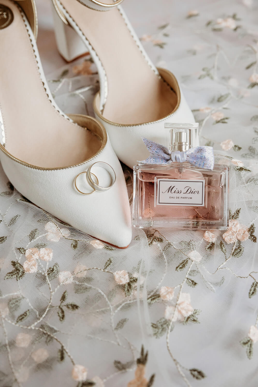 a brides wedding shoes and rings captured by a hampshire wedding photographer