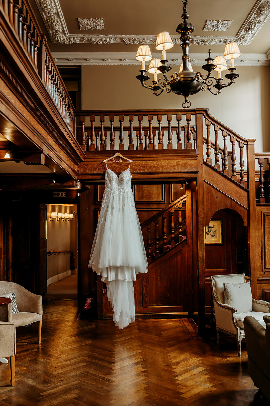 a brides wedding dress hung up