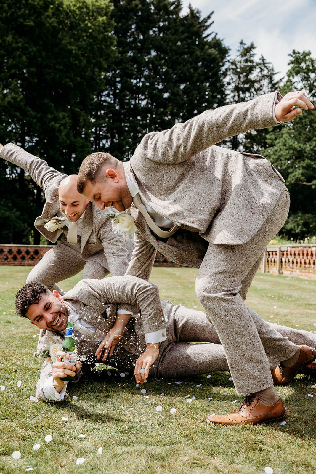 groomsmen having fun taken by a hampshire wedding photographer