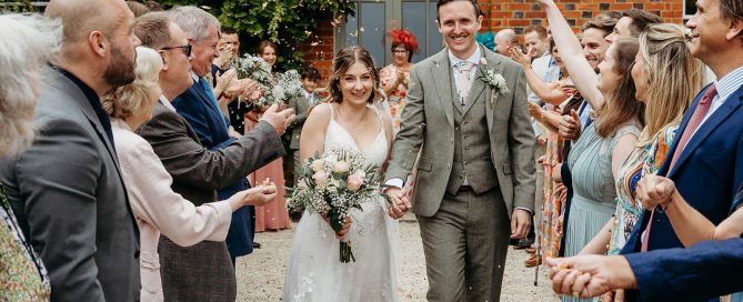 confetti walk with bride and groom at ridgeway barn wedding venue