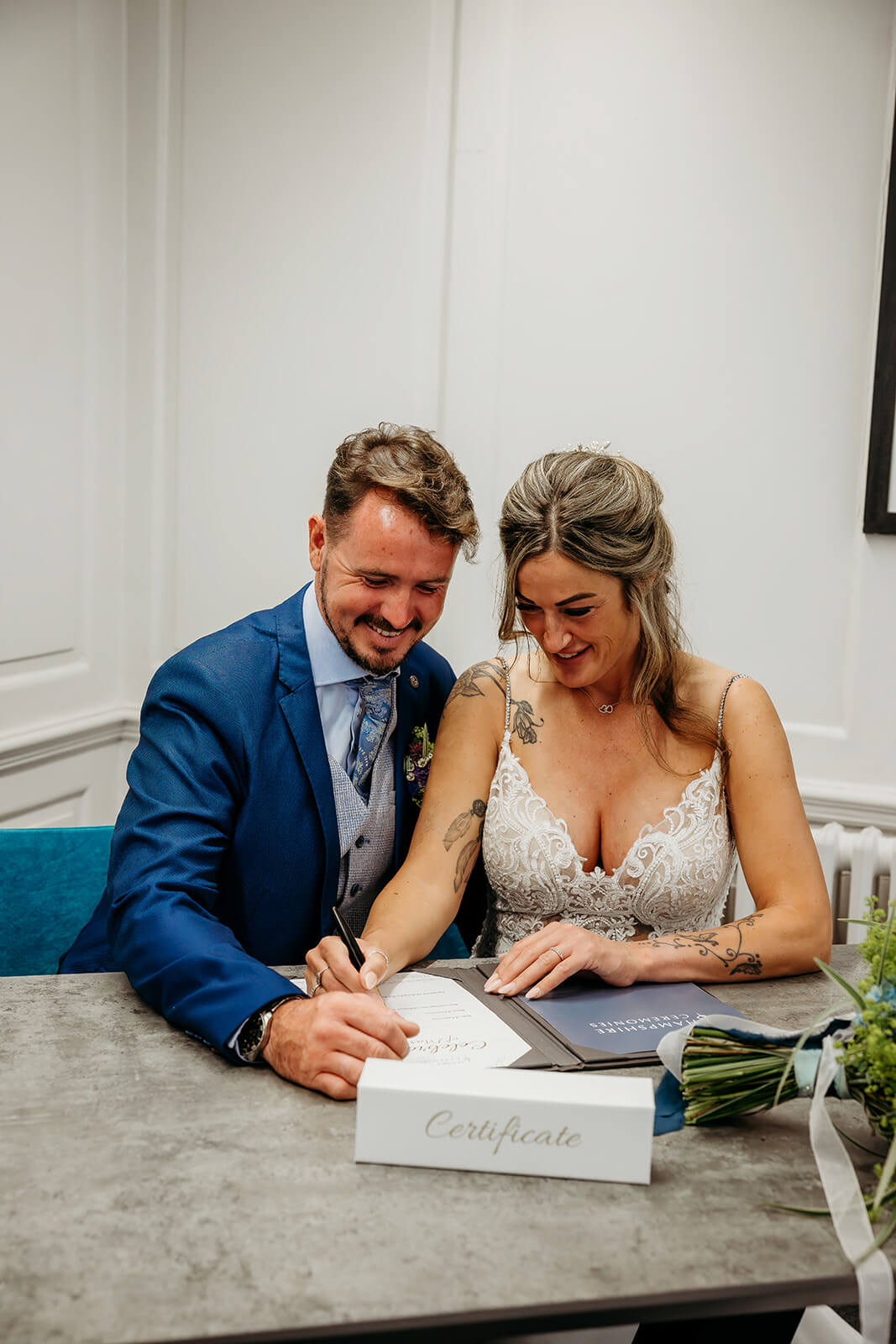 winchester_registry_office_NK_Photography bride and groom at the Westgate room signing the certificate captured by a Winchester registry office photographer