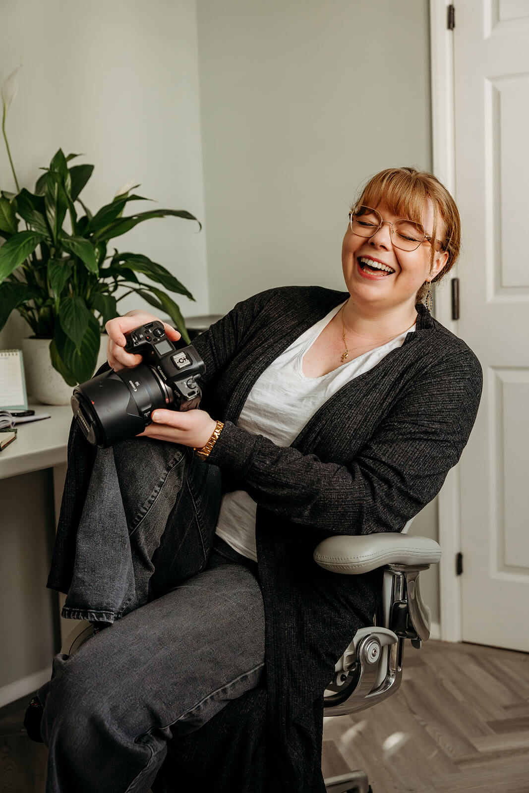 NK_Photography_hampshire_wedding_and_family_photographer headshot of NK Photography laughing, a hampshire wedding and family photographer