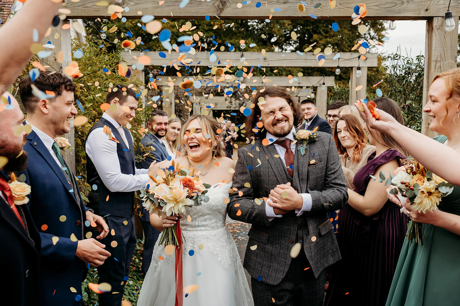 nk photography capturing a couple in their confetti tunnel in hampshire