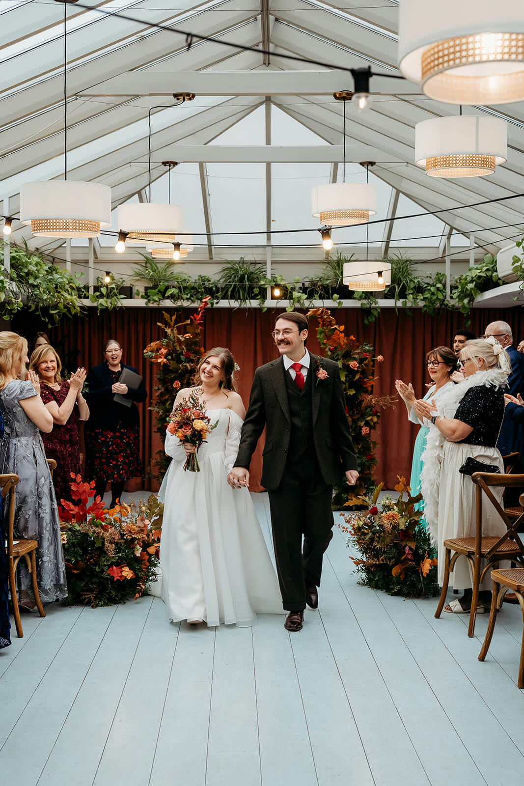 NK_Photography__hampshire_wedding_photographer-2 couple walking down the aisle after their ceremony captured by a hampshire wedding photographer in London at the mitre hotel