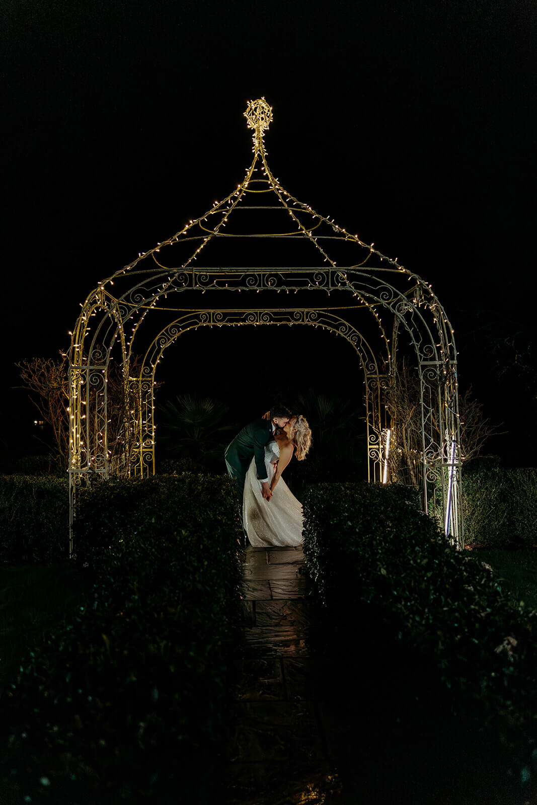 hampshire_wedding_photographer_southdowns_manor-2 a couple kissing at night time at Southdowns Manor captured by a hampshire wedding photographer