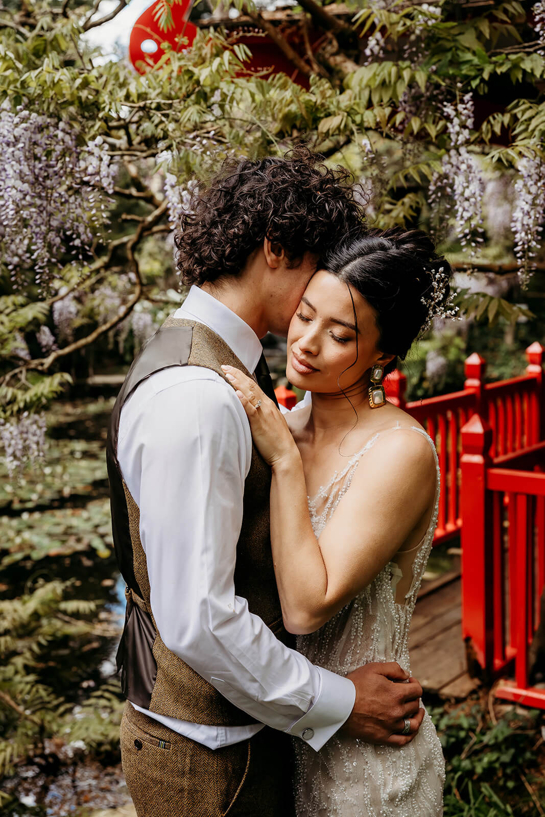 NK_Photography__Italian_Villa-45 a bride and groom embracing each other in a Chinese garden